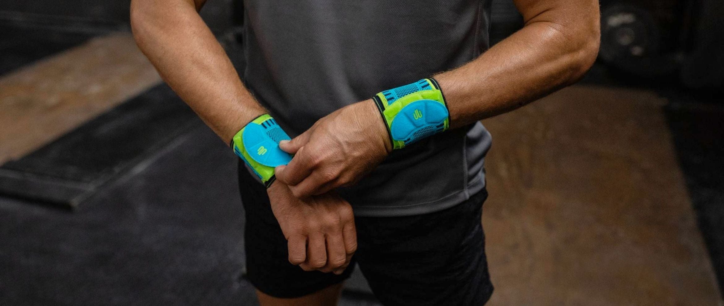 man putting on volleyball wrist straps
