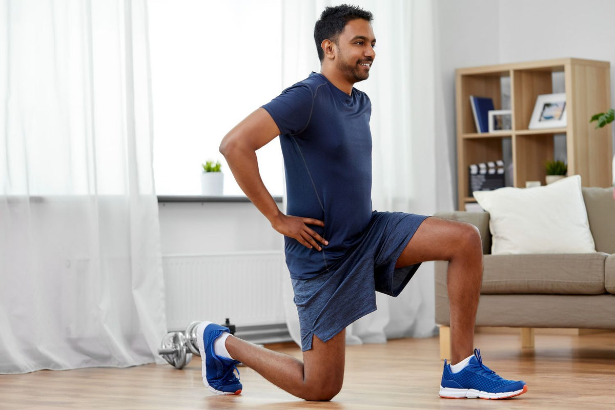 man doing lunges in his living room