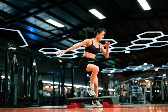 woman doing the up and overs exercise at the gym