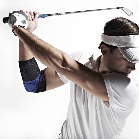 Person playing golf wearing a Bauerfeind elbow brace