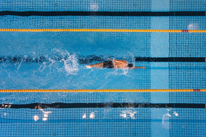 Man swimming laps in the pool