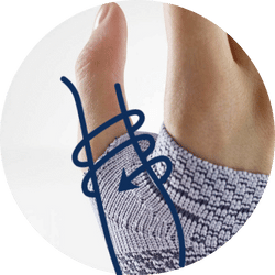 Close-up of a hand wearing a Bauerfeind ManuTrain wrist support with anatomically contoured comfort zones around the thumb. 